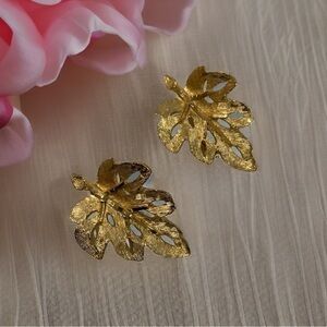 Vintage shiny gold leaf clip earrings. Marked “B.S.K.”